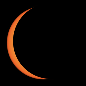 Mostly black square with a thin crescent of orange on the left side.
